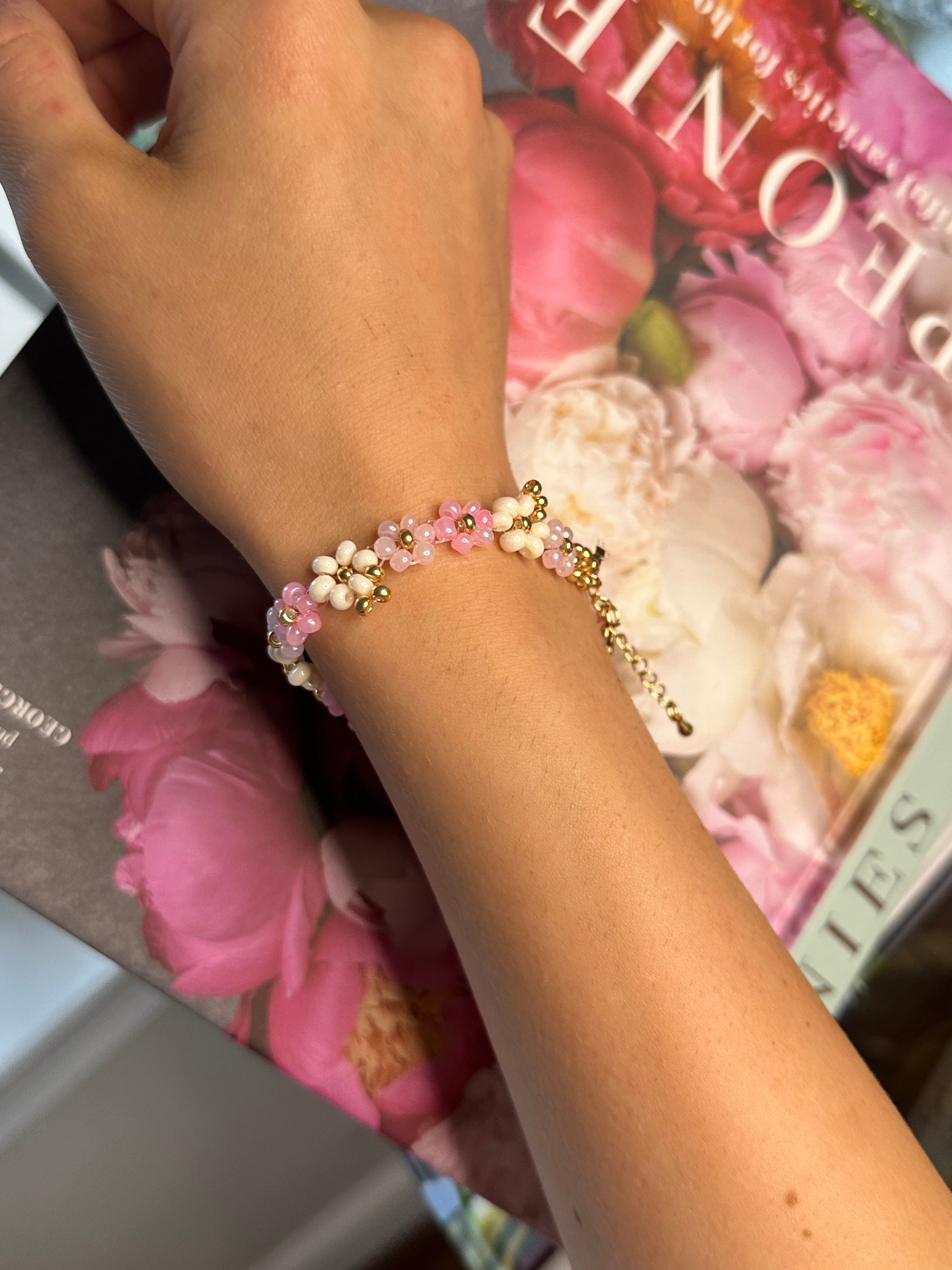 pink floral beaded bracelet with gold accents