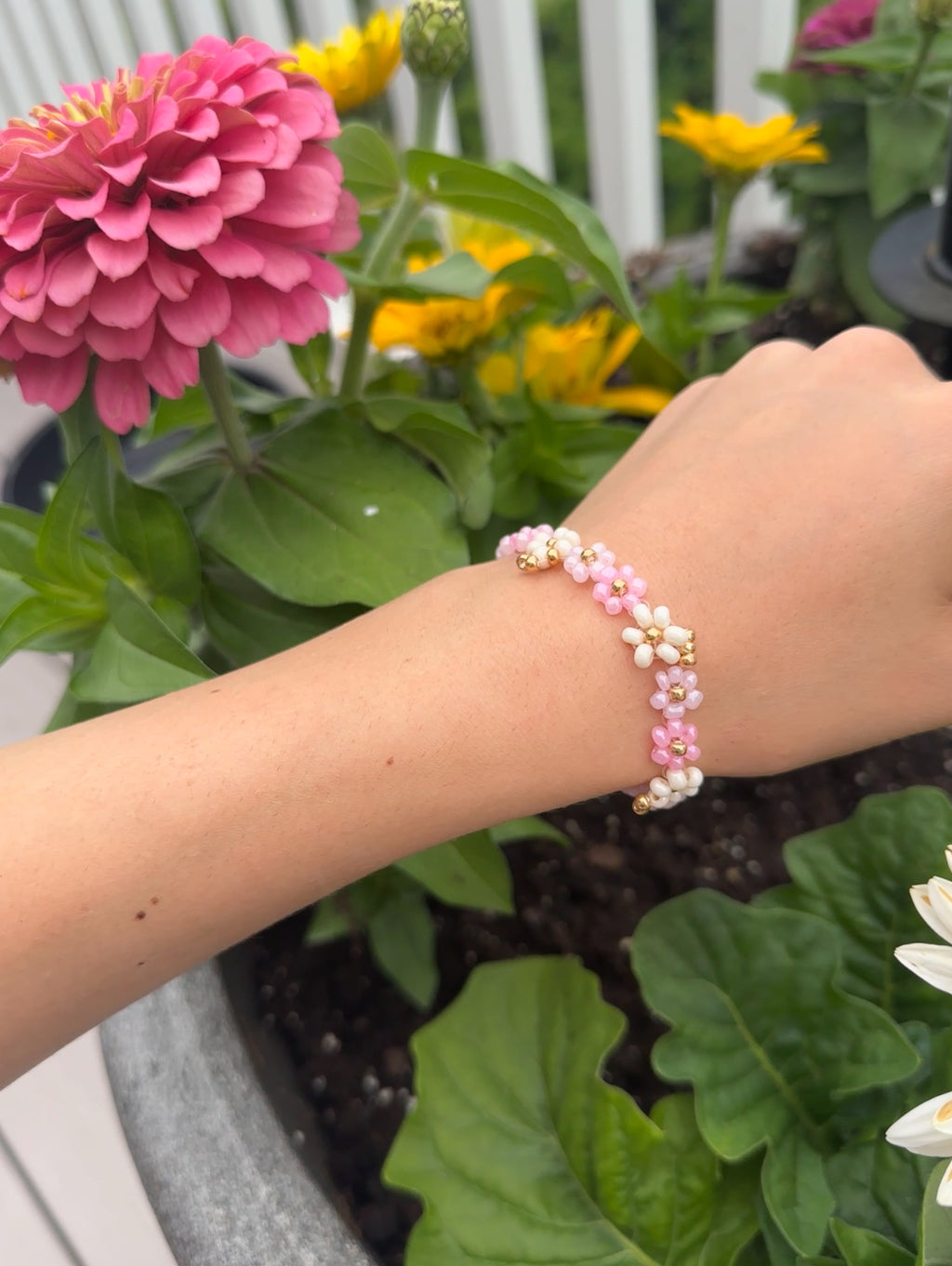 pink floral beaded bracelet with gold accents