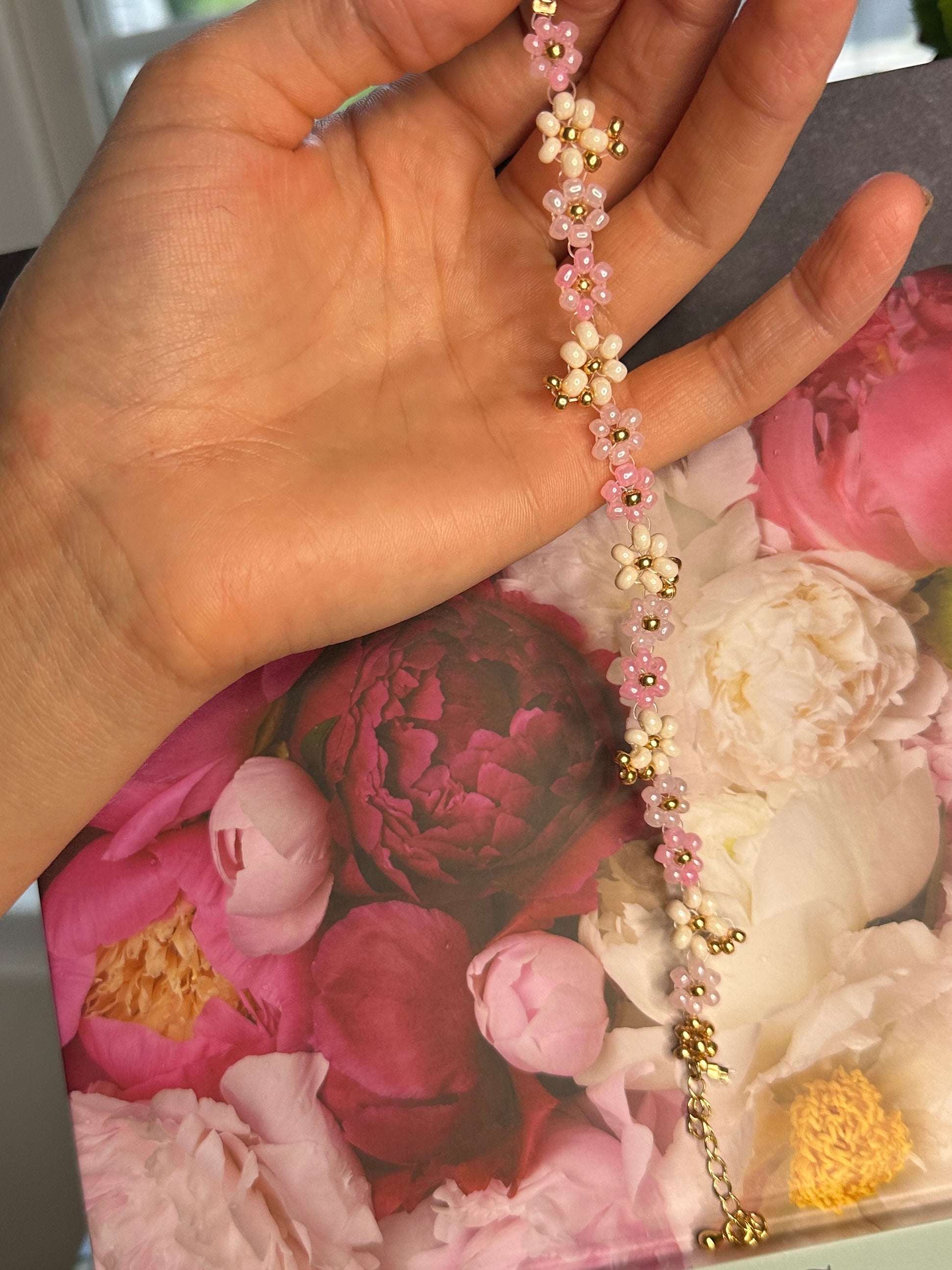 pink floral beaded bracelet with gold accents