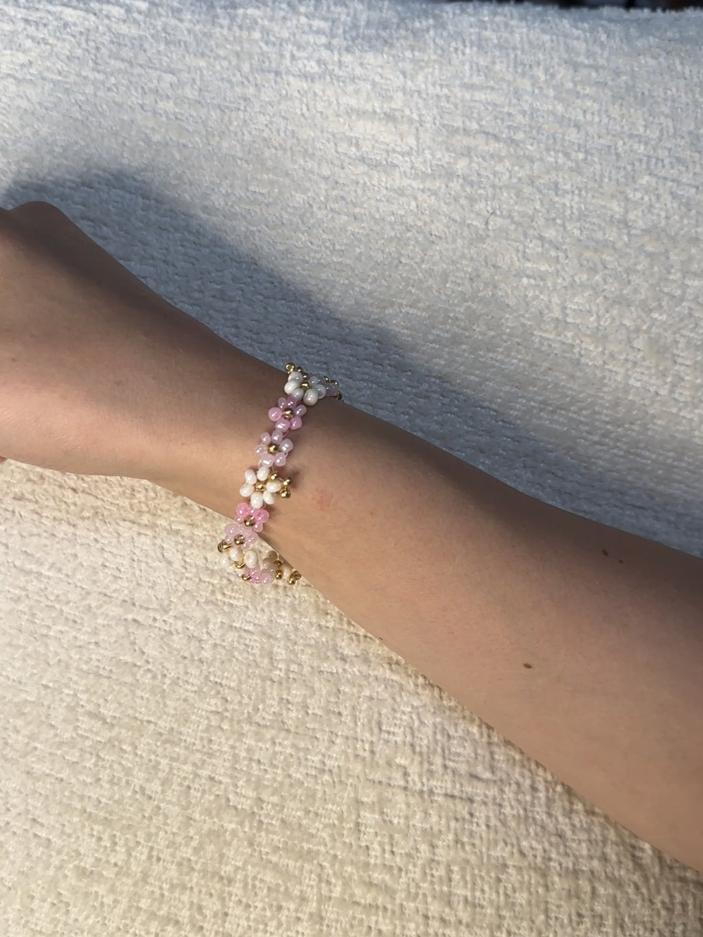 pink floral beaded bracelet with gold accents