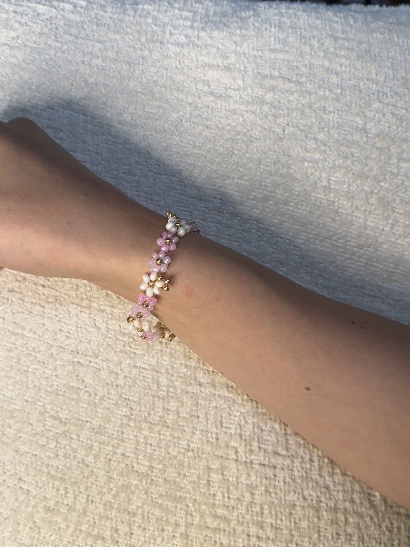 pink floral beaded bracelet with gold accents